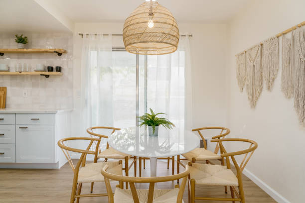 Minimalist Dining Area with White Table and Light Wood Chairs