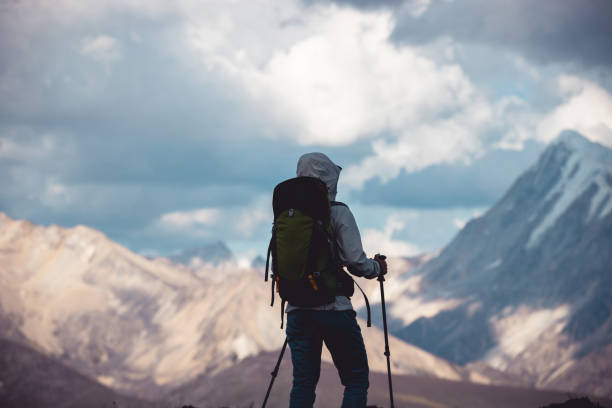 istock Woman hiking on high altitude mountain top 2189461692