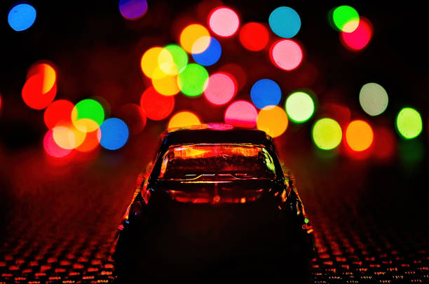 A toy car is silhouetted by Christmas lights, Jan. 1, 2017, in Coden, Alabama.
