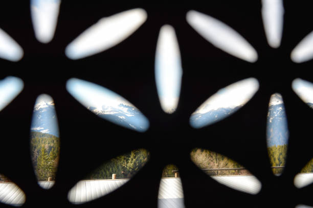 view on a little window on a stone facade in a of a alpine chalet