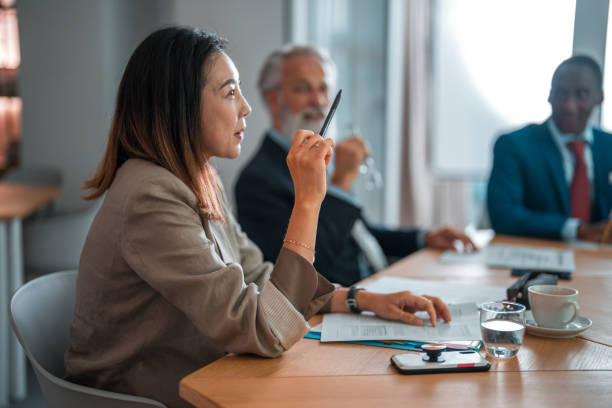 istock Pretty Asian Female Talking In Human Resources Meeting 2189474806