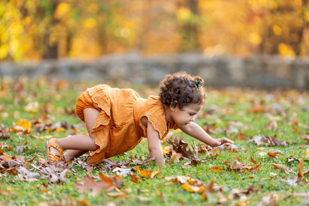 istock Baby girl crawling on the grass 2189474895