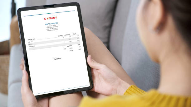 istock Woman hand using digital tablet with E receipt on screen, Tele finance, Business technology and lifestyle 2189481274