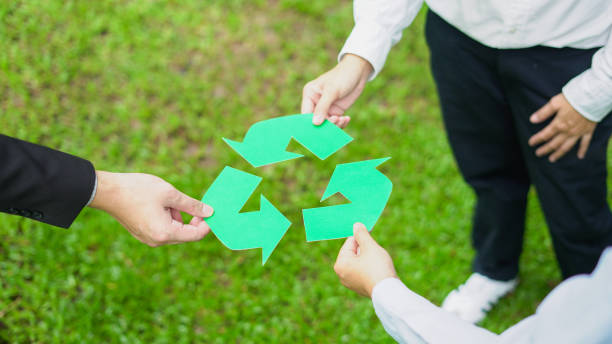 istock team collaboration to promote recycling,  reuse symbolizing sustainability and shared responsibility for greener future. 2189484558