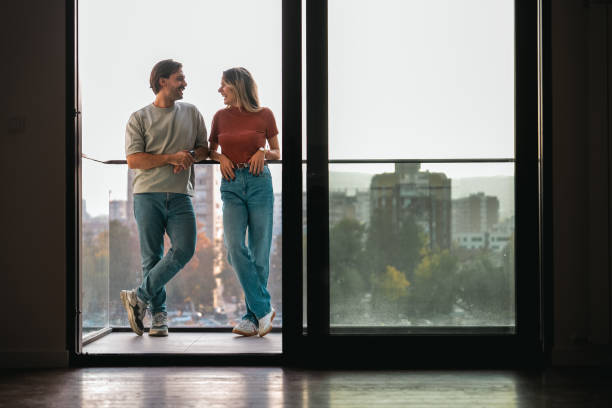 istock Couple enjoying beautiful day on a balcony 2189485349