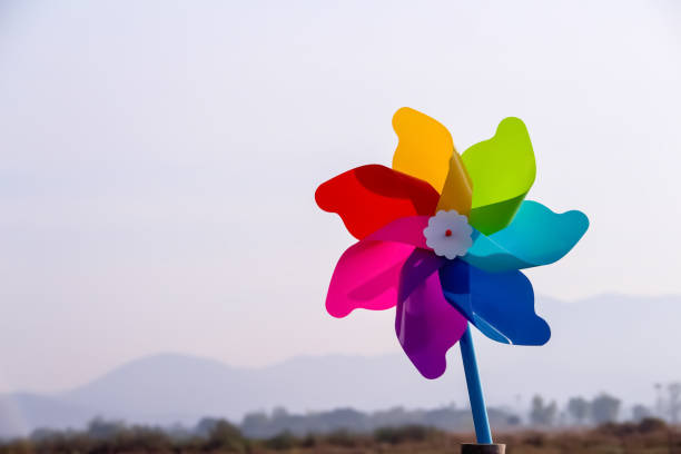 Colorful wind turbine on mountains view background