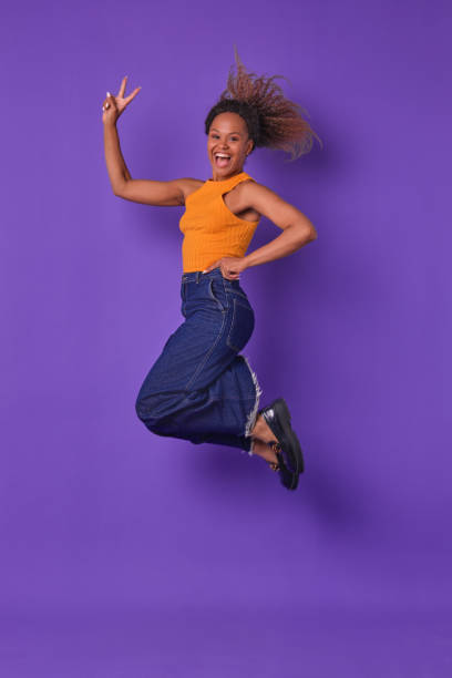 istock Celebrating Joy With a Lively Jump Against a Vibrant Backdrop 2189493645