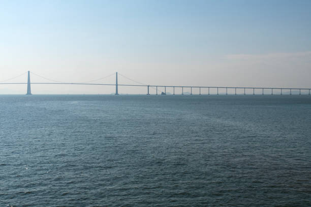 istock suspension bridge on the sea 2189496694