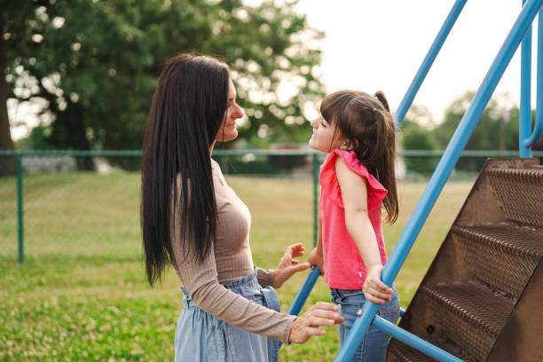 istock Mother and daughter at the park in Summer 2189497672