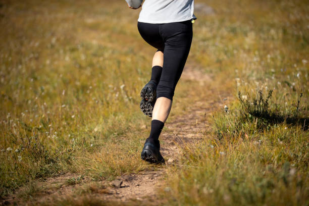 istock Fitness woman runner running in grassland 2189497830