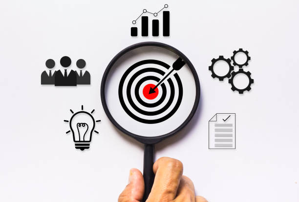 istock Focus target icon inside the magnifying glass to focus on the objective. Business concept on white background and corporate development 2189502550