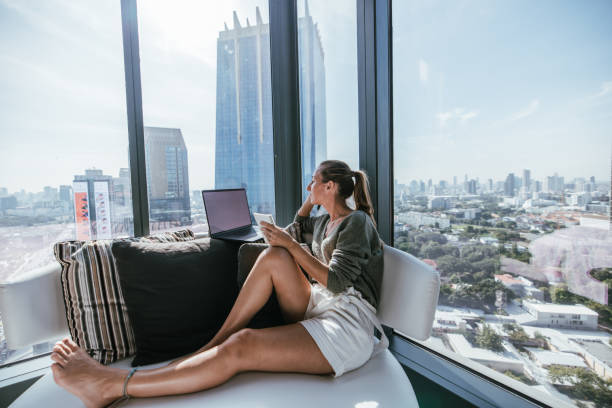 istock Woman Planning with Notebook and Laptop in Modern Apartment 2189503214