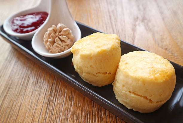Mouthwatering Scones with Cinnamon Whipped Cream and Raspberry Jam