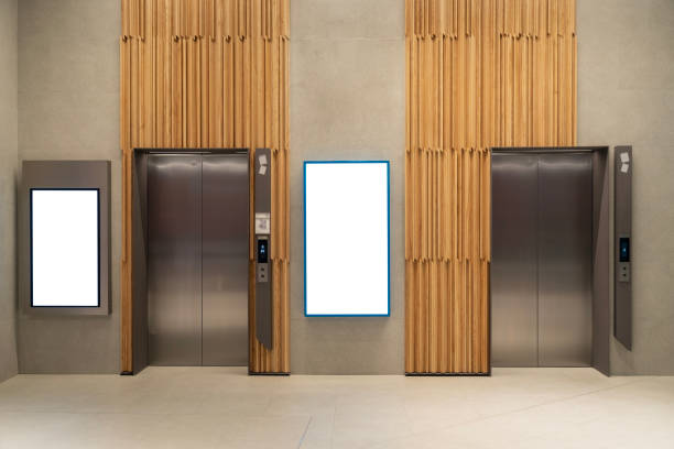 Metal Elevator Lobby with two vertical Mockup Billboard in modern building