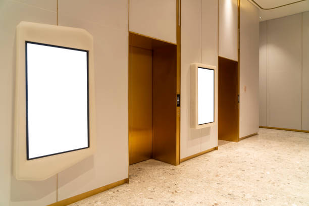 istock Metal Elevator Lobby with two vertical Mockup Billboard in modern building 2189509778