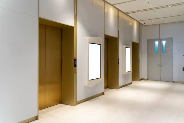 istock Metal Elevator Lobby with two vertical Mockup Billboard in modern building 2189509835