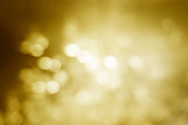 golden yellow bokeh glittering shining background