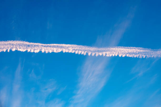 Smoke trails left by a jet plane in the sky