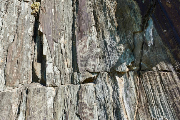 istock Close-up texture of a stone wall. Natural rock background. 2189515978