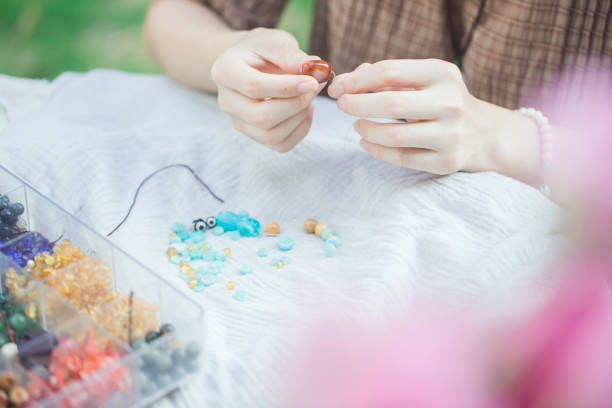 istock A woman is DIY crafting bead strings 2189516681