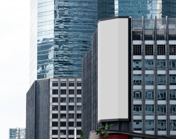 istock Gray vertical large LED display billboard on building with cityscape background 2189519433