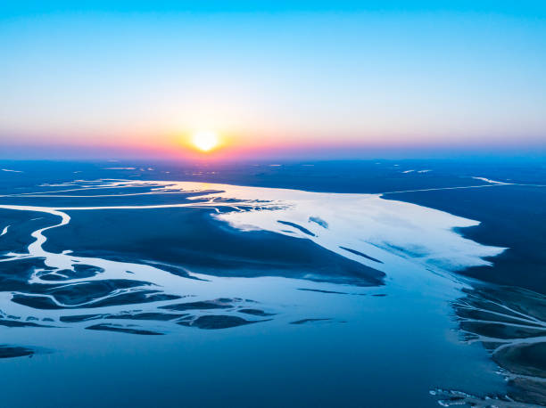 istock Sunset, wetland park lake landscape overlooking 2189519881