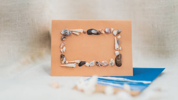 istock Beautiful Handmade Gift Card for Festive Use with Space for Copy Text, ocean beach inspired seashell frame 2189521312