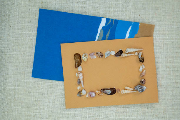 istock Flat Lay Beach Theme Greeting Card with Seashell Frame and Space for Copy Text, ocean inspired gift card 2189521455