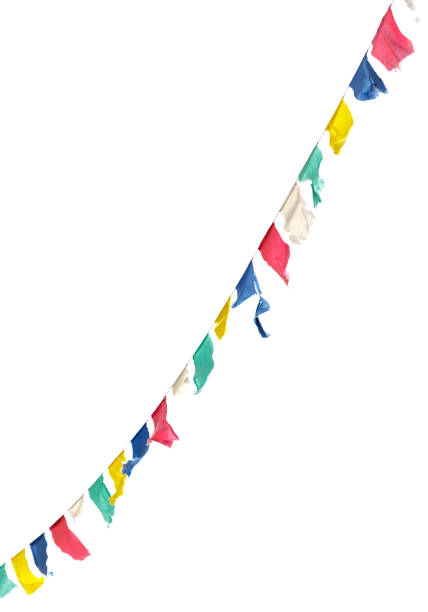 A long line of colorful flags hanging from a white background. The flags are of different colors and sizes, creating a vibrant and lively atmosphere