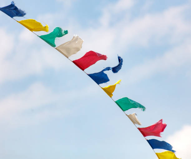 istock A colorful banner with frayed edges is hanging from a pole 2189528817