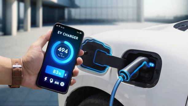 istock Smartphone application with digital EV car battery status on the screen. peruse 2189532144