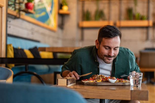 istock Tasting Italy - Man enjoying authentic pizza in a local pizzeria 2189533656
