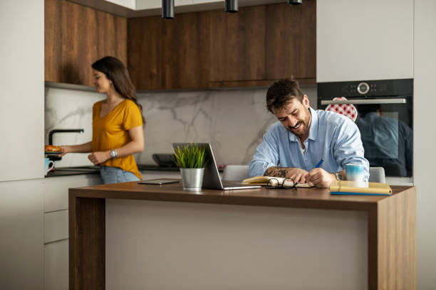 istock Happy Couple Enjoying Leisure Time in Modern Kitchen 2189533694