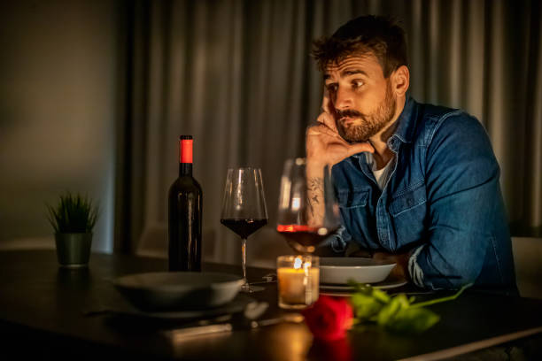 istock Pensive Man Reflecting During Candlelit Dinner at Home 2189533870