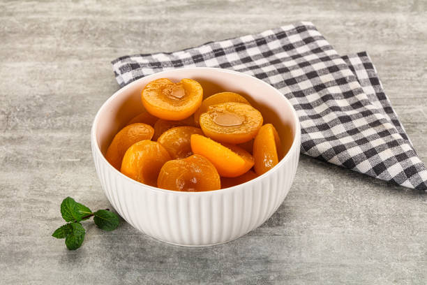 istock Sweet canned apricots with syrope 2189535780