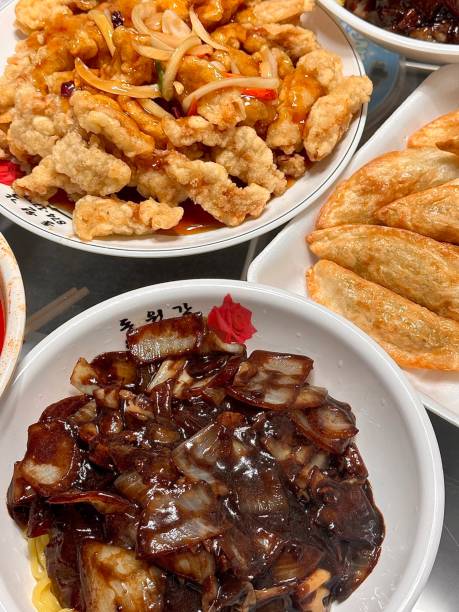 Jajangmyeon, a popular Korean dish featuring thick wheat noodles topped with a rich, savory black bean sauce made from chunjang, diced pork, and vegetables. Hearty and flavorful, it’s a comforting, satisfying meal.