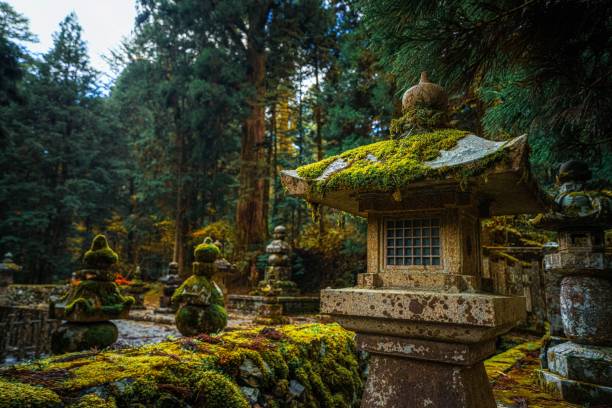 istock Mossy Stone Lanterns in Japanese Forest 2189537177