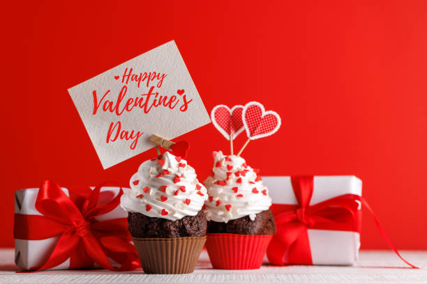 istock Cupcake love: Heart-themed treats on a vibrant red backdrop 2189539360