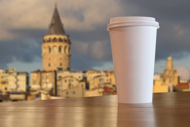 Paper Coffee Cup on Table with Galata Tower in Istanbul