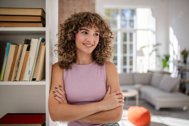 istock Smiling young woman posing confidently in a modern home interior 2189541261