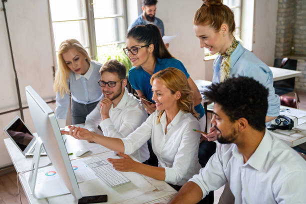istock Group of young multi-ethnic startup business team collaborating on project in modern office 2189541449