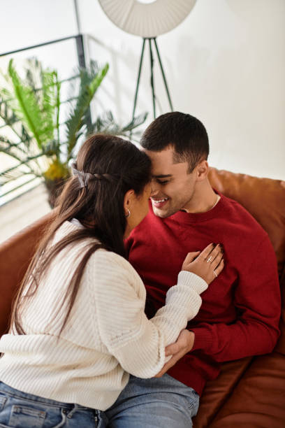 istock Cozy moments shared between a loving couple in a modern winter apartment 2189542432