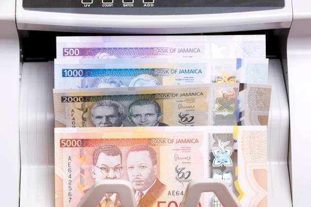 istock Jamaican dollar in the counting machine 2189543164