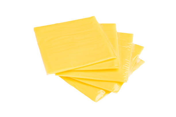 istock Square  Slices of processed Cheddar cheese in individual plastic packaging isolated on white background 2189544227
