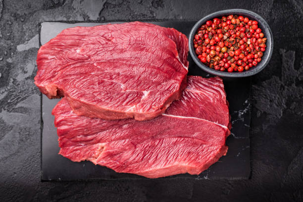 istock Raw Roe Deer steak, fresh Wild Venison Game Meat. black background. top view 2189544718