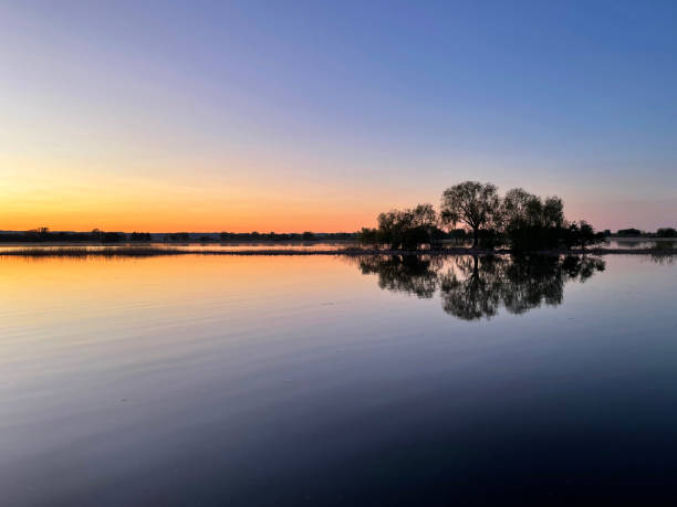 istock Sunset reflected in the perfect surface of the river 2189546060
