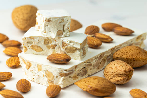 istock Hard nougat, with almonds next to it. 2189546652