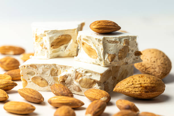 istock Hard nougat, with almonds next to it. 2189546664