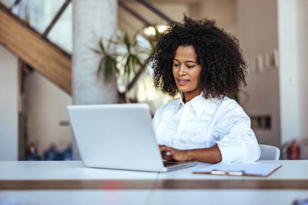 istock Professional Woman Using Laptop at Bright and Modern Office Workspace 2189549152