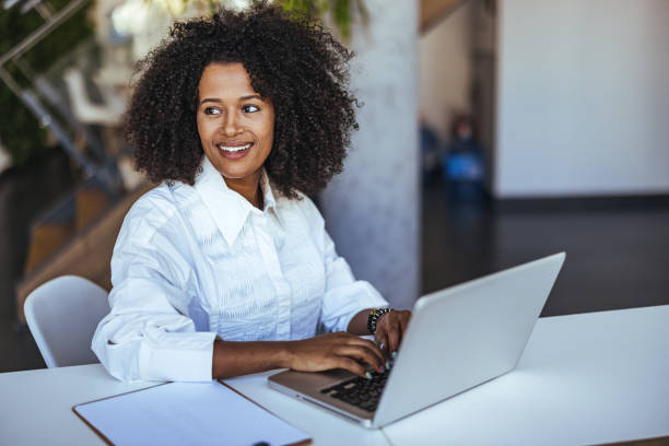 istock Confident Business Professional Working on Laptop in Modern Office Environment 2189549226